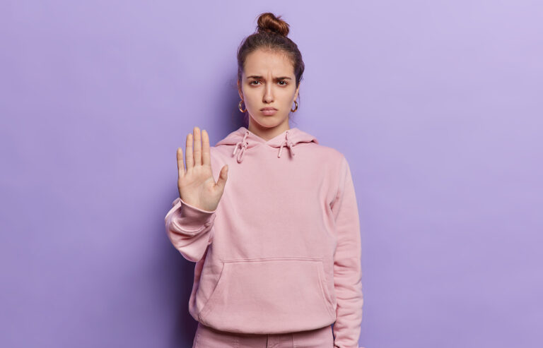 Woman confidently setting boundaries and saying no without guilt